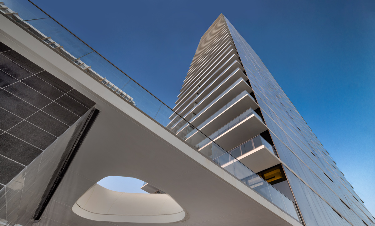 Architectural dusk entrance view at the 2000 Ocean condo in Hallandale Beach, FL.