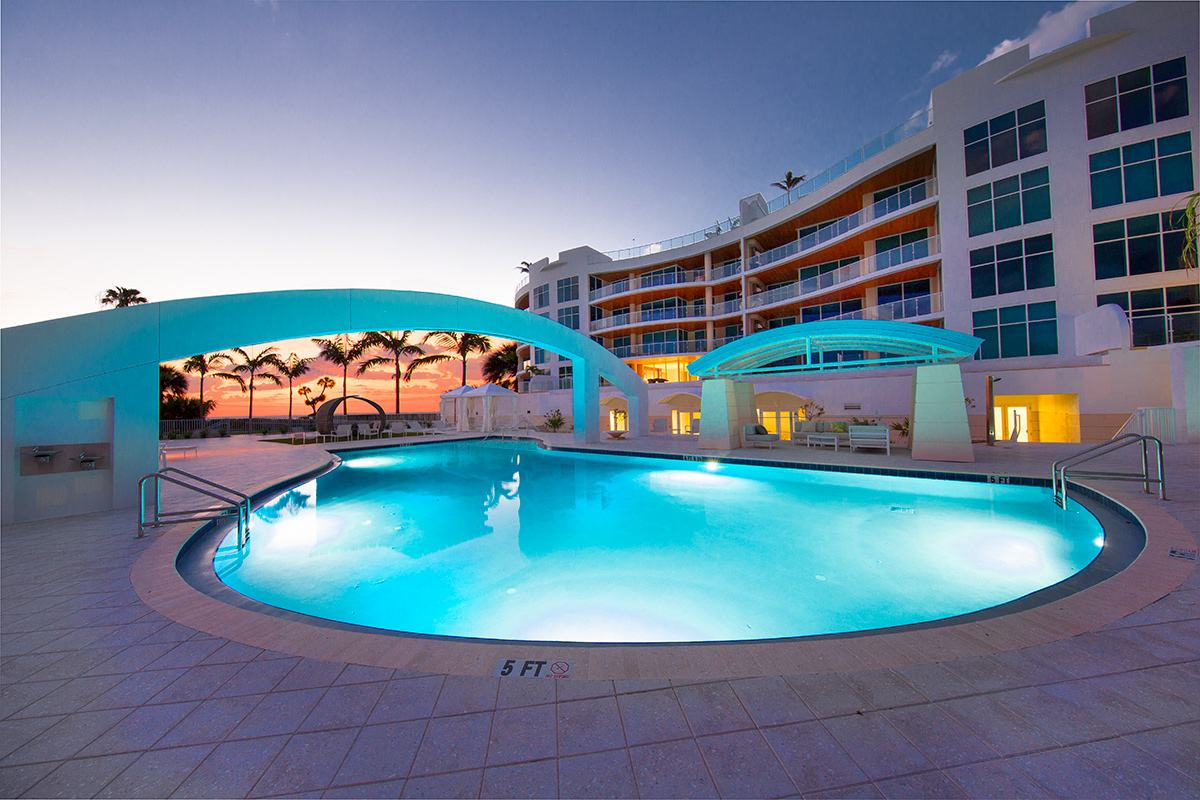 Architectural pool dusk view at Aria Luxury Condos Longboat Key - Sarasota, FL.