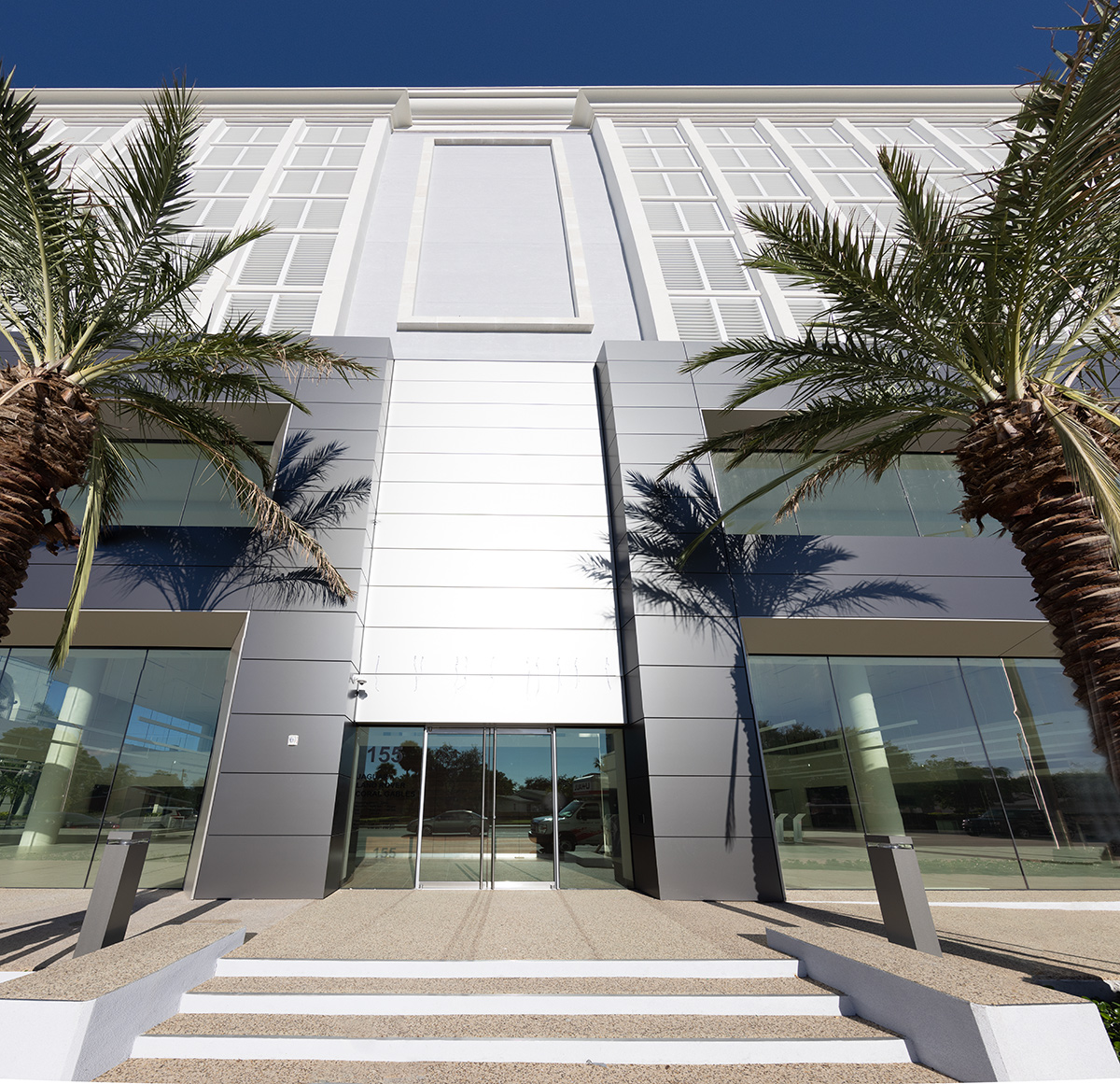 Architectural entrance view of the Miami Jaguar - Land Rover dealership.