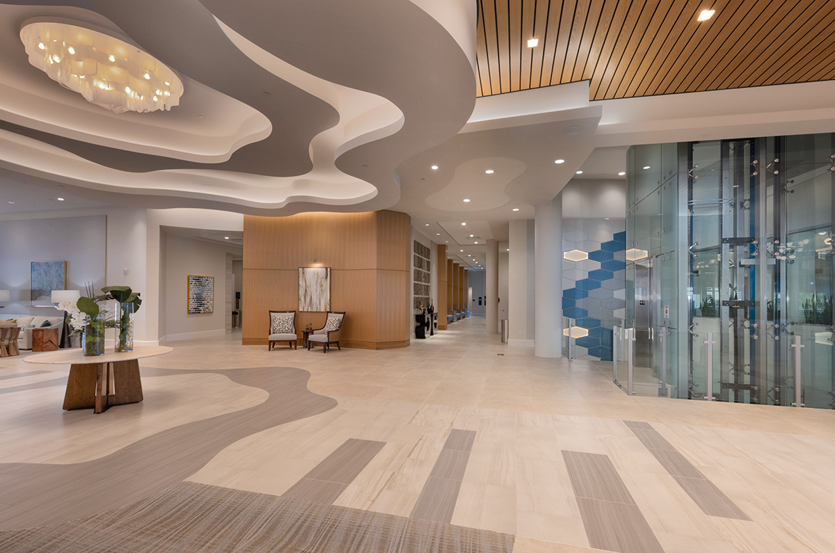 Interior design lobby elevator view of Moorings Grand Lake Clubhouse in Naples, FL.