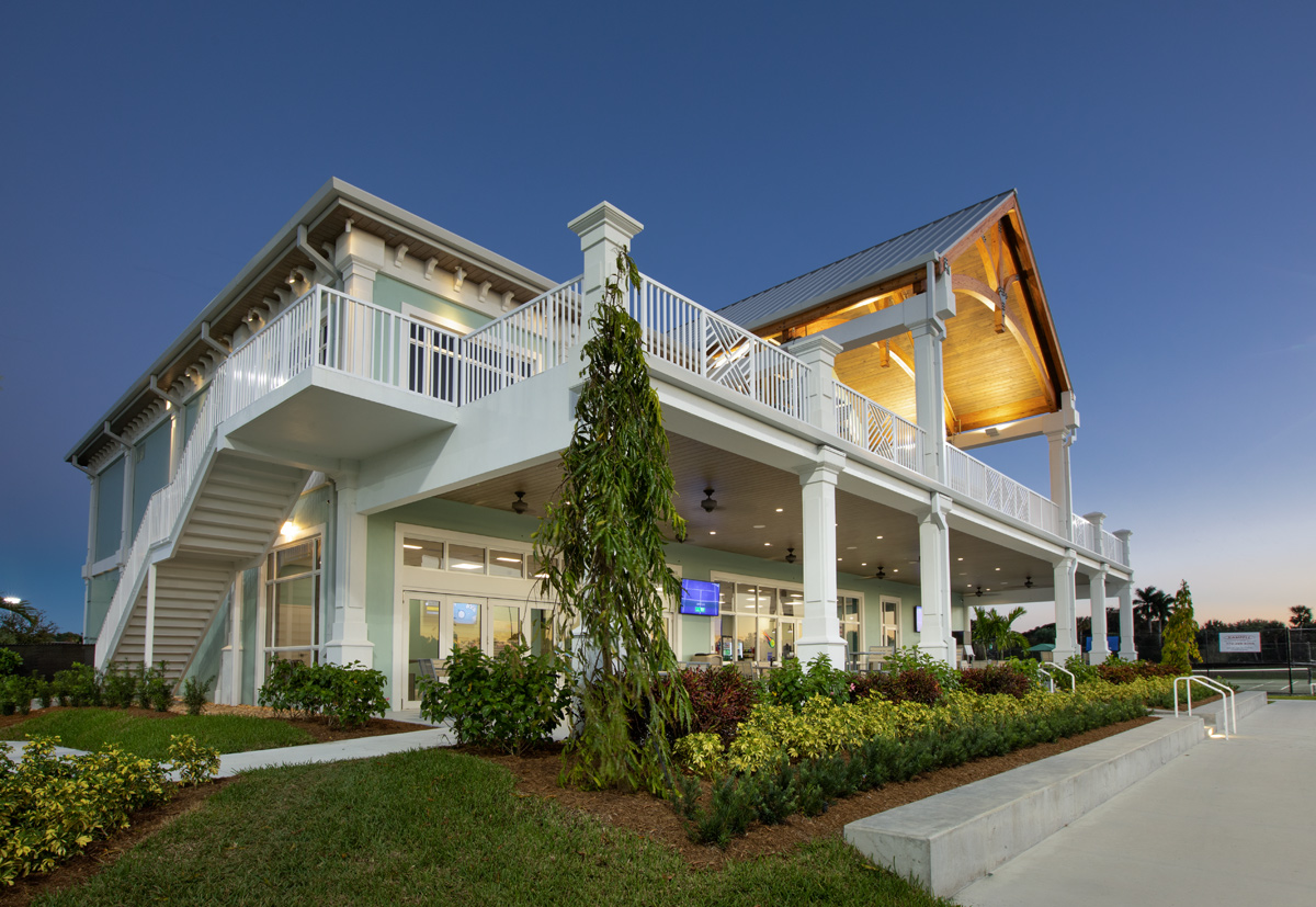 Architectural dusk view of the Palm Beach Gardens, FL tennis clubhouse.