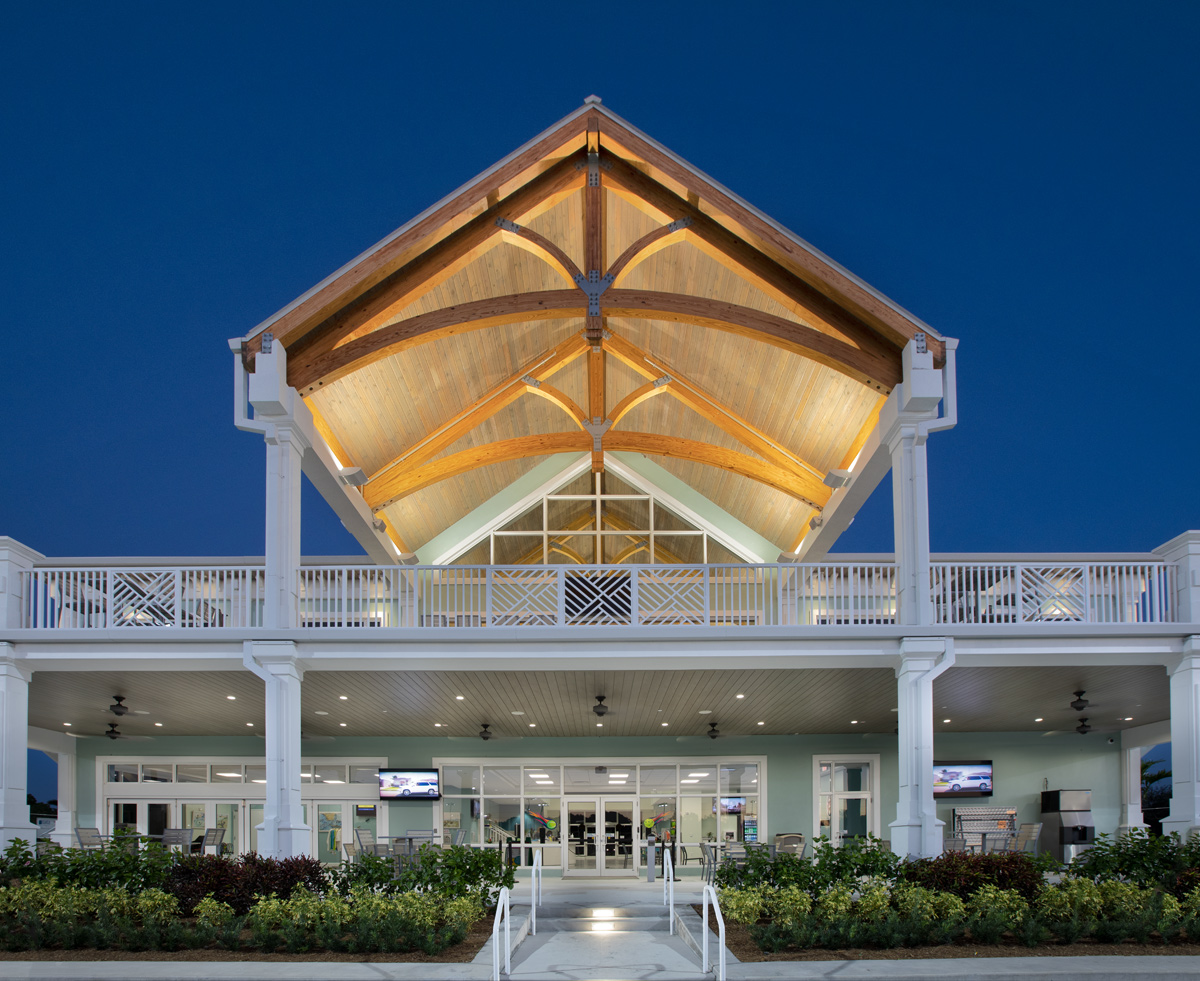 Architectural dusk view of the Palm Beach Gardens, FL tennis clubhouse.
