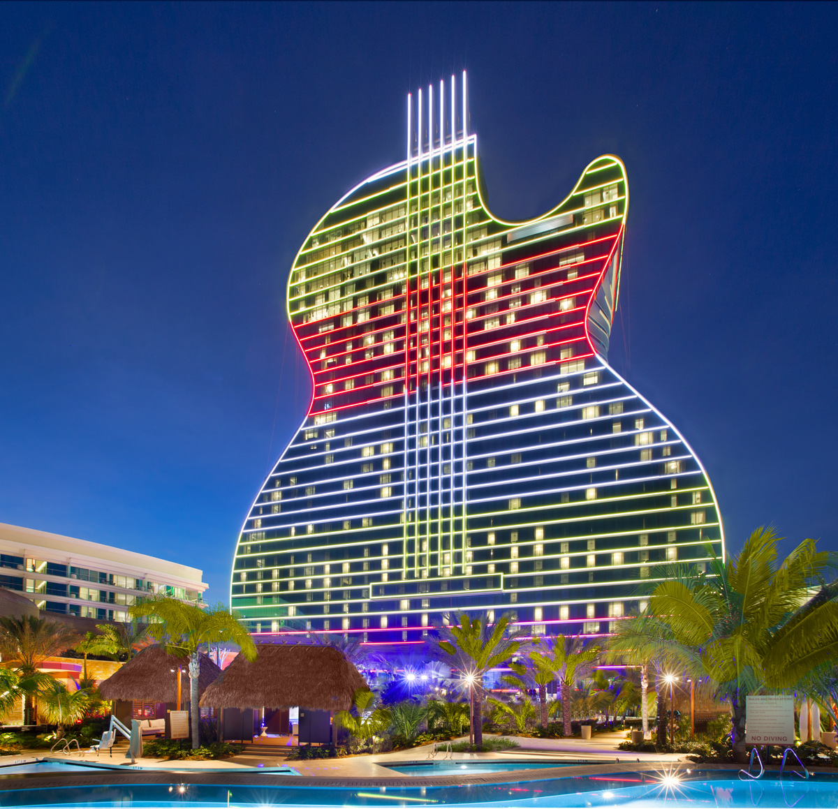Architectural dusk view of the Hard Rock Hollywood guitar hotel.