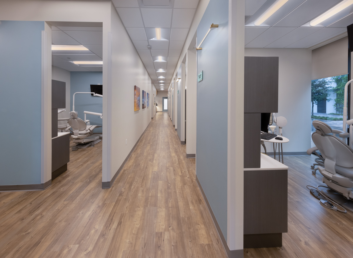 Dental Care Alliance Miami, FL treatment room and corridor.