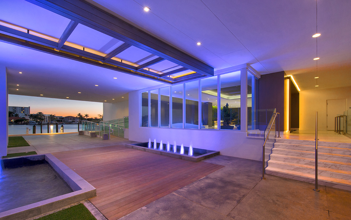 Architectiural dusk view of the entrance at the 400 Sunny Isles condo.