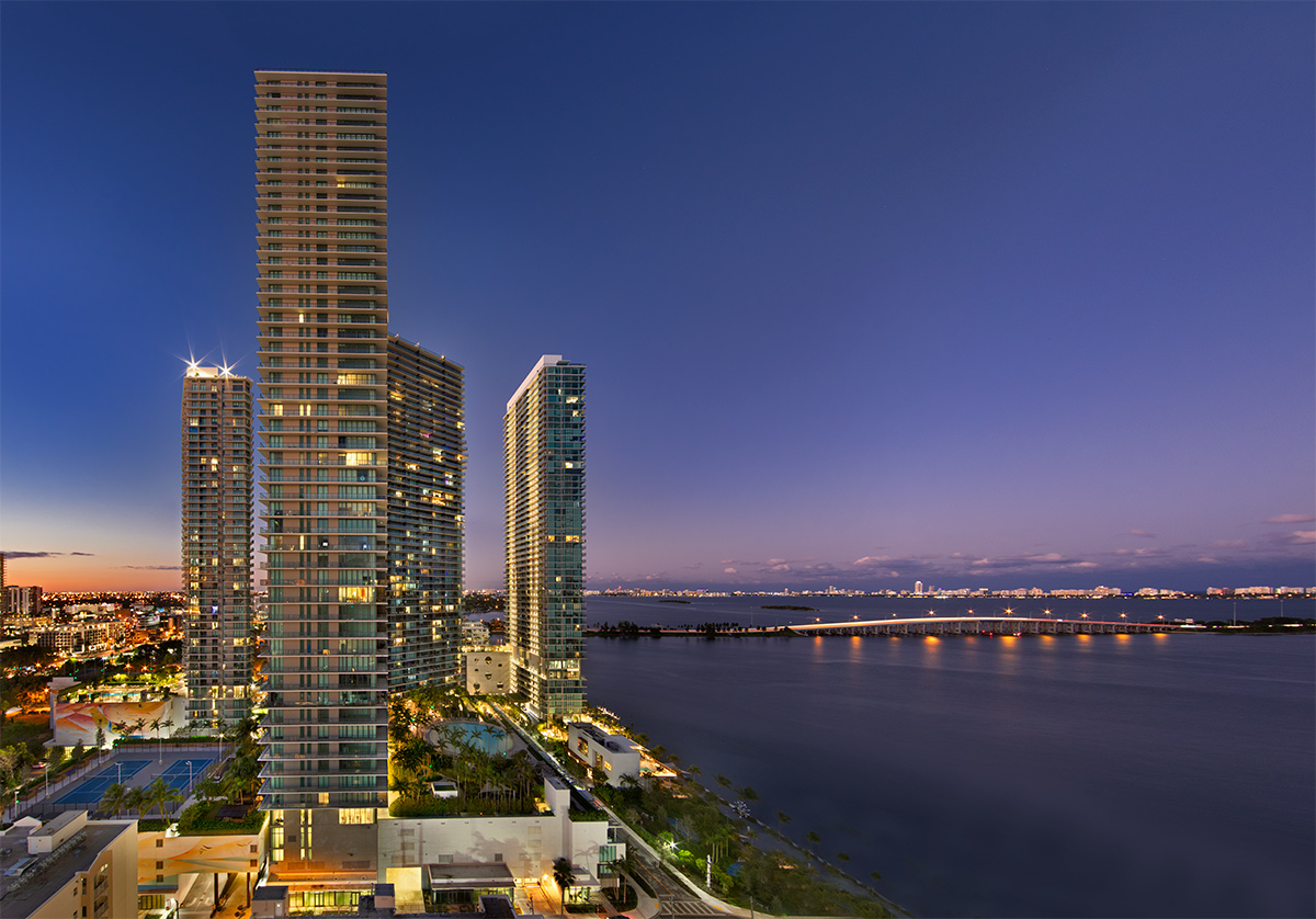 Paraiso Bay condo towers Miami architectural dusk view.