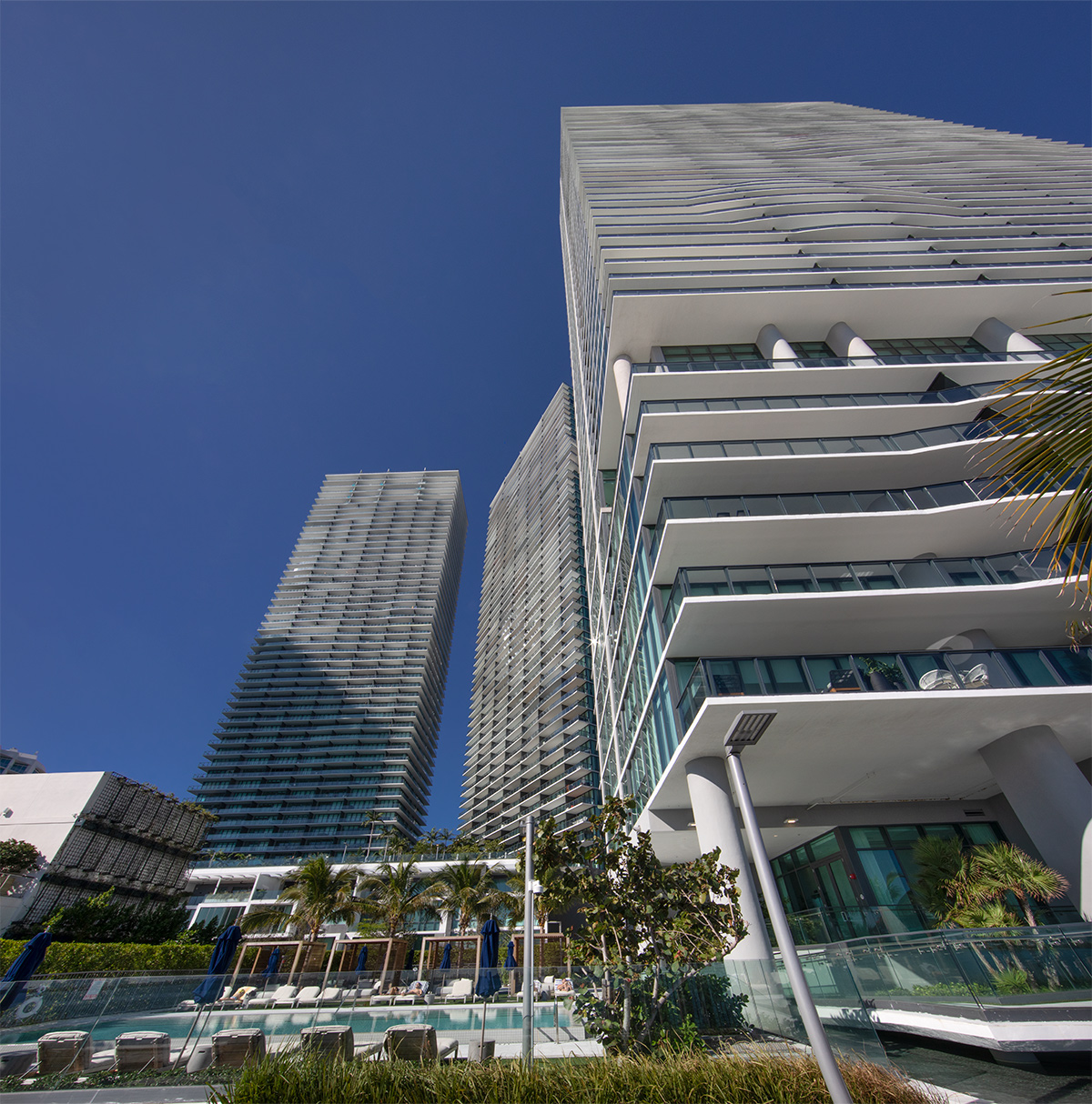 Paraiso Bay condo towers Miami pool view.