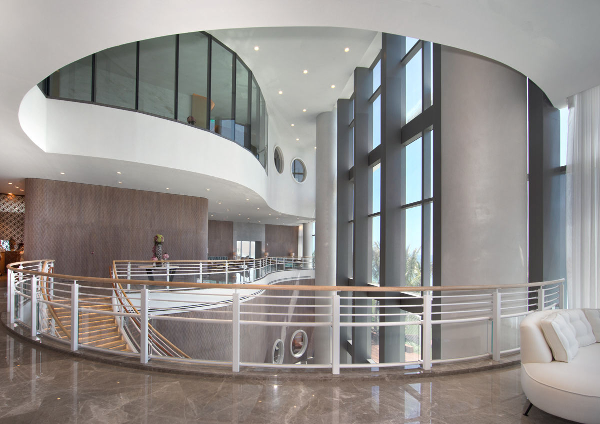 Lobby staircase of the Ritz CDusk exterior of Ritz Carlton Residences in Sunny Isles Beach, FLarlton Residences in Sunny Isles Beach, FL