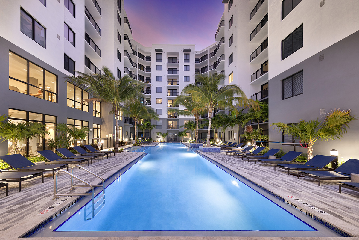 Architectural dusk pool view at Shoma Village luxury rental  Miami, FL.