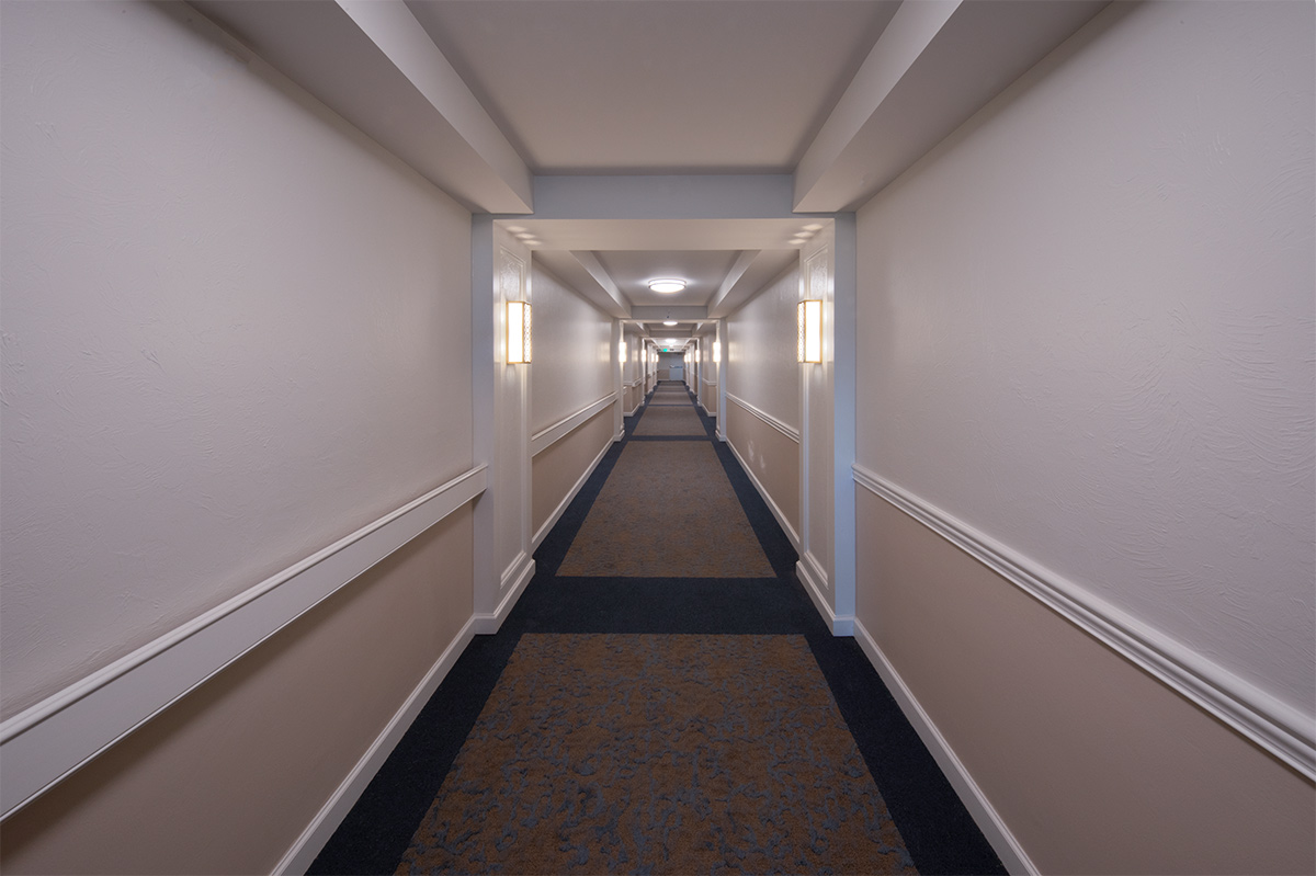 Interior design hallway view of Moorings Park Grande Lake Build G for senior living in Naples, FL