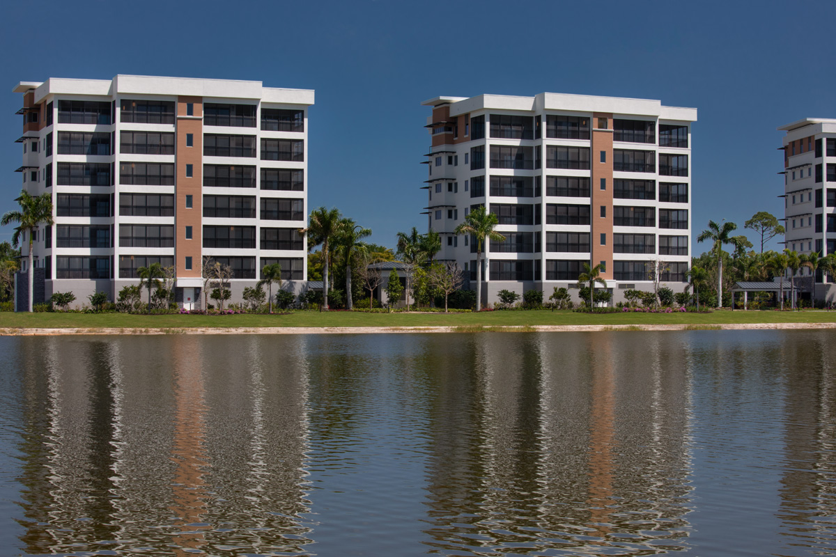 Architectural water view of Moorings Park Grande Lake Senior Living in Naples, FL