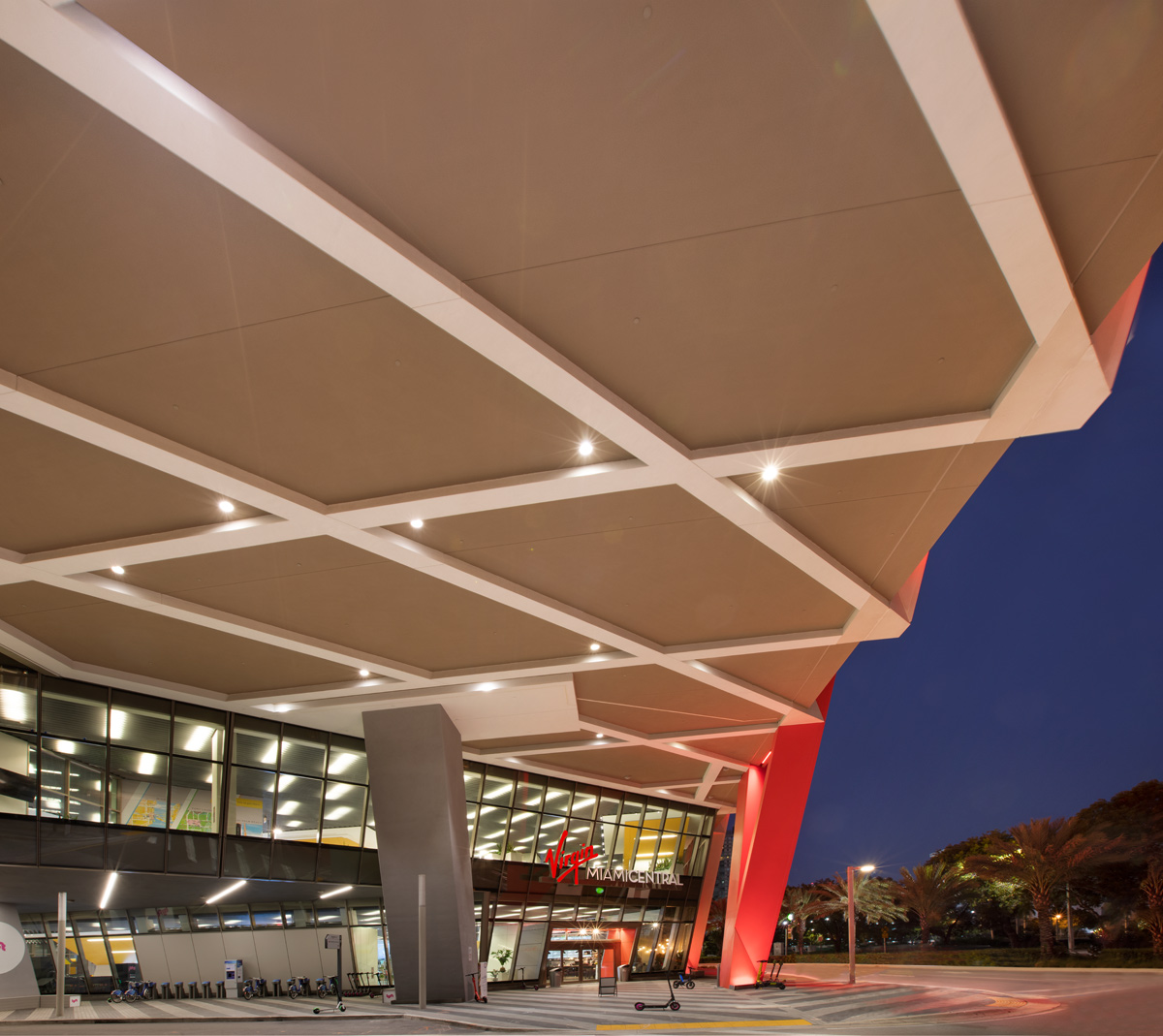 Architectural dusk view of the Brightline Miami Central terminal  entrance.