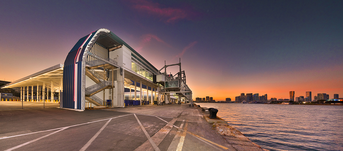 Architectural dusk view of Port Miami terminal F boarding apron.