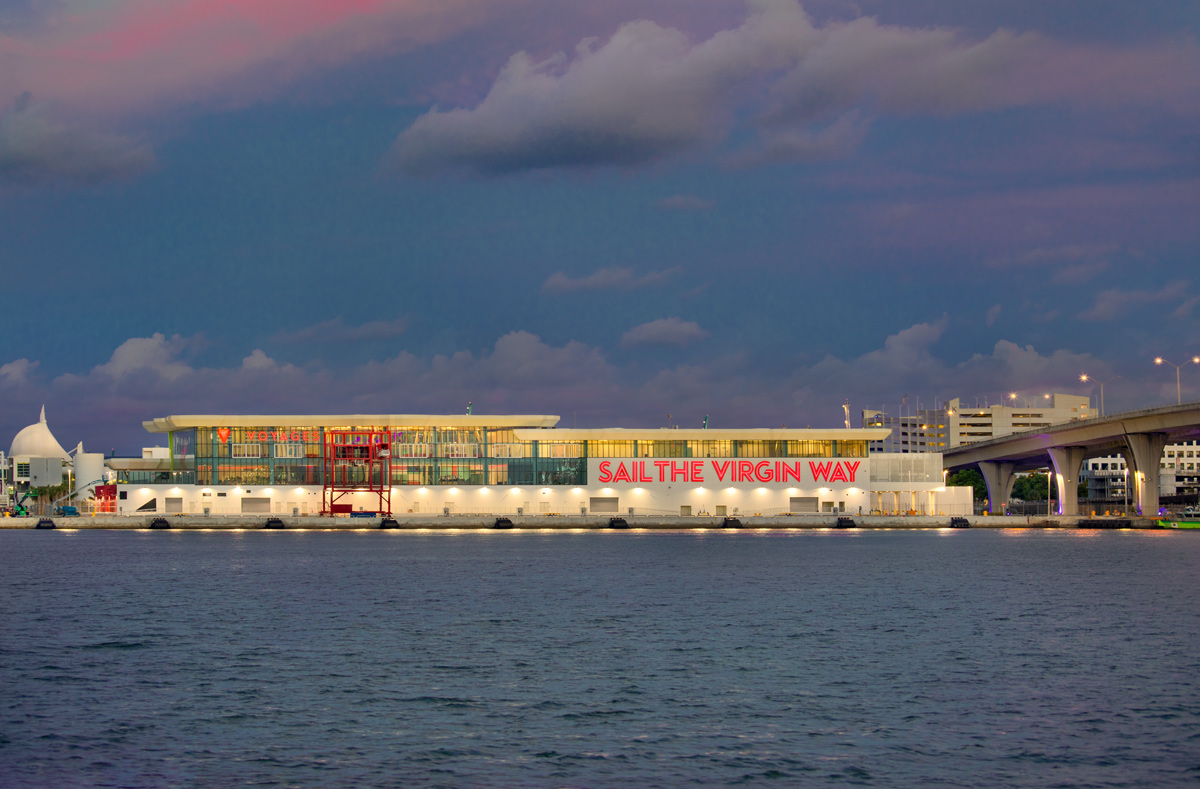 Architectural dusk water view of the Virgin Voyages Terminal B Port Miami, FL.
